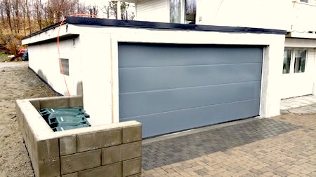 Garasje i helstøpt betong, støttemur og terrasse på taket i Trondheim Garasje i helstøpt betong, støttemur og terrasse på taket i Trondheim